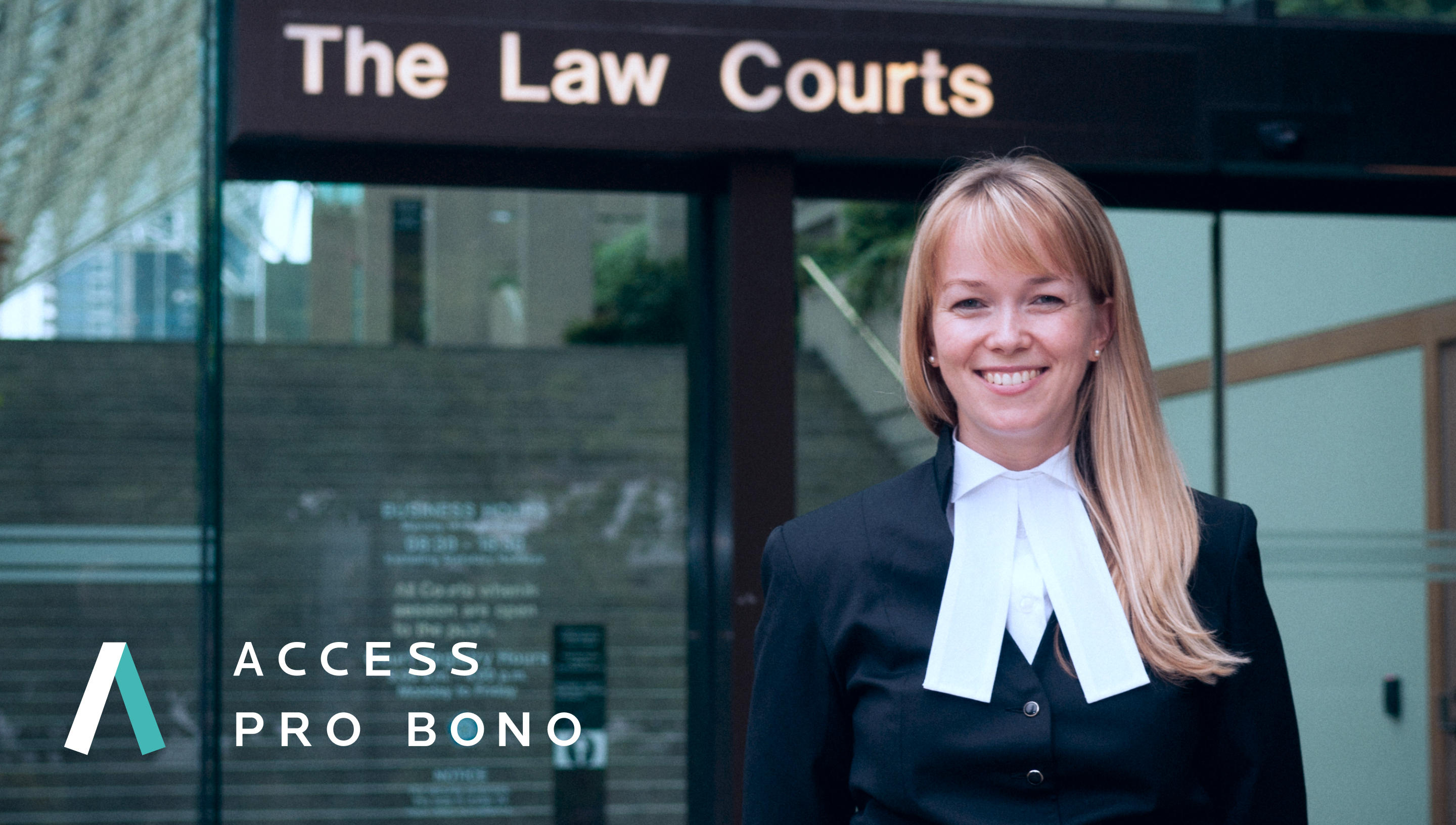 Woman standing in the front of The Law Courts building with the Access Pro Bono logo