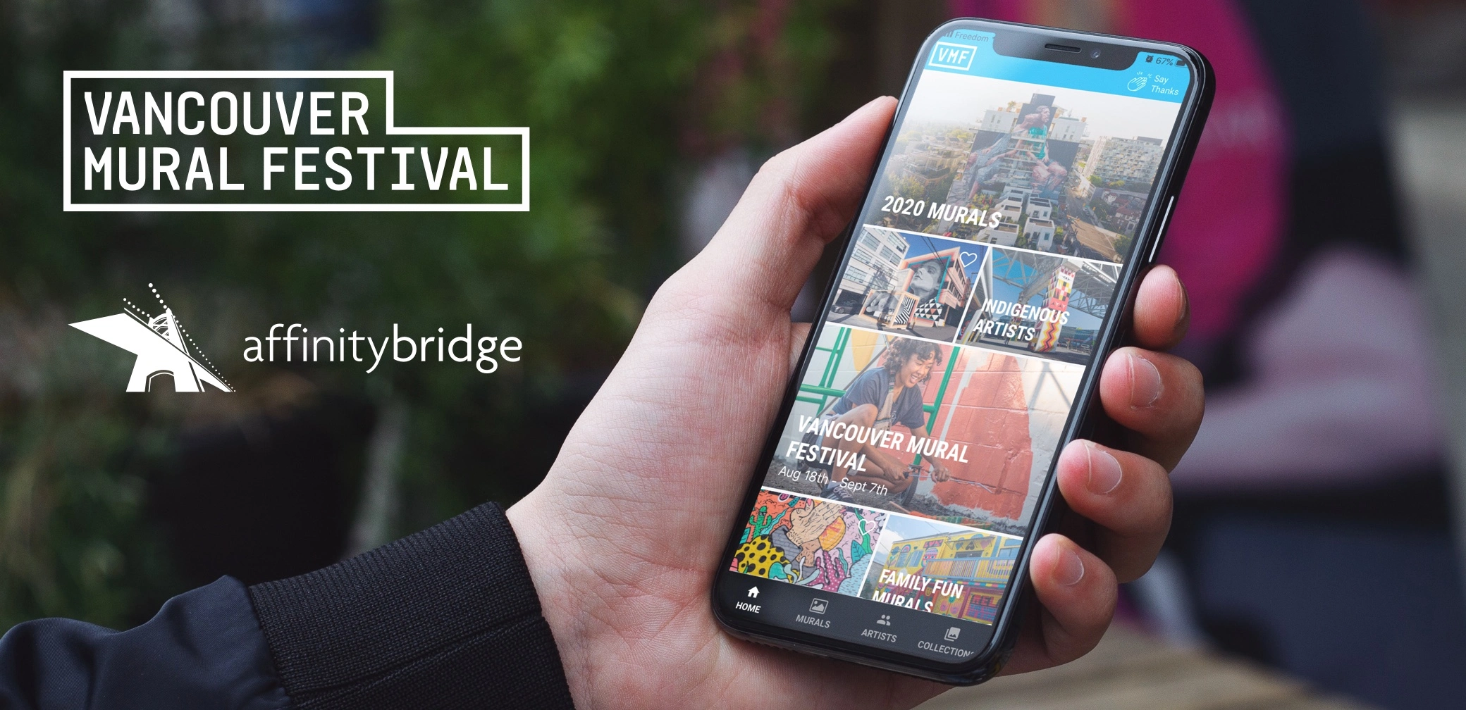 a mobile device with the Mural Fest app is shown in someone's hand