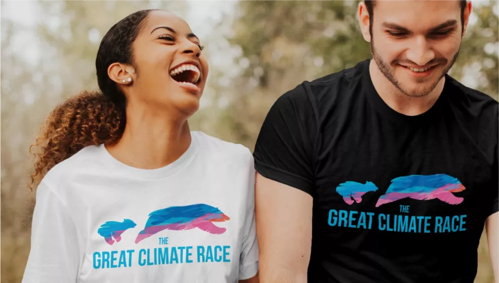 girl and guy wearing a t-shirt with the Great Climate change logo on it