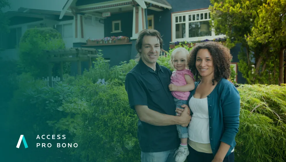 Man and woman holding a child in front of their home. Access Pro Bono logo is in the bottom left. 