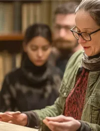 librarian guiding a group through a special collections